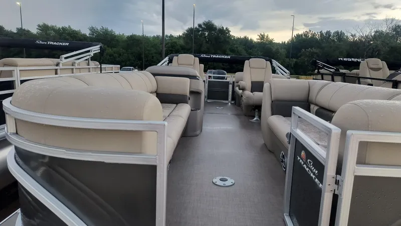 Slide: The Image of 2024 Sun Tracker Party Barge 24 DLX pontoon boat with spacious seating and modern design. - 2