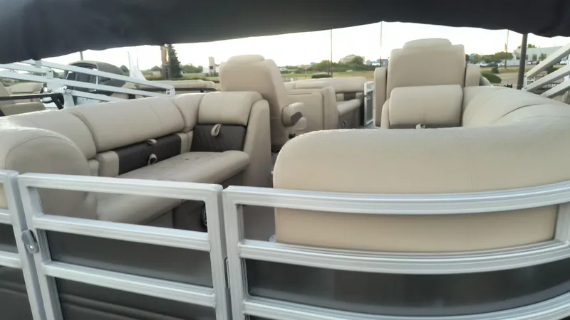 Slide: The Image of 2024 Sun Tracker Party Barge 24 DLX interior with beige seating. - 3