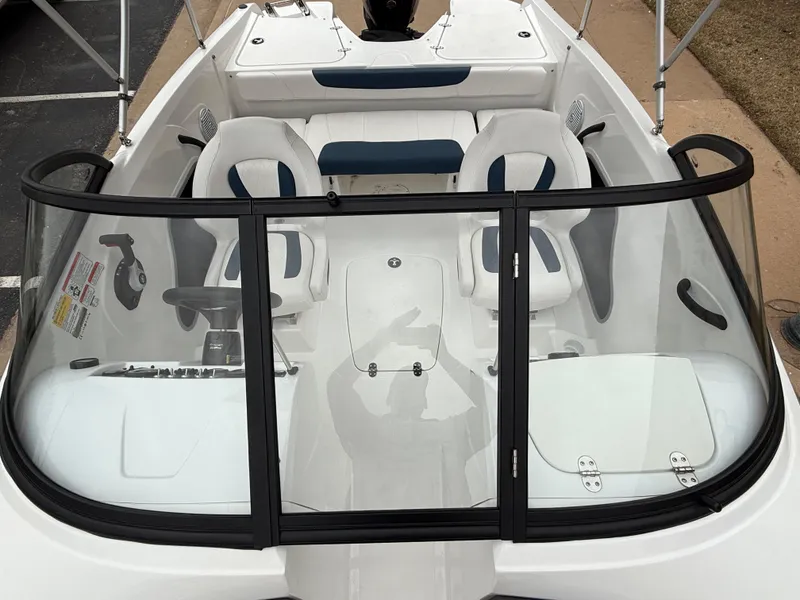 Slide: The Image of 2023 Tahoe 185 S boat interior with seating and windshield, showcasing modern design. - 5