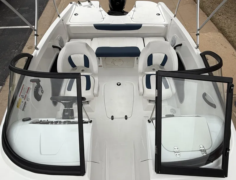Slide: The Image of 2023 Tahoe 185 S boat interior with dual seats and open windshield. - 6