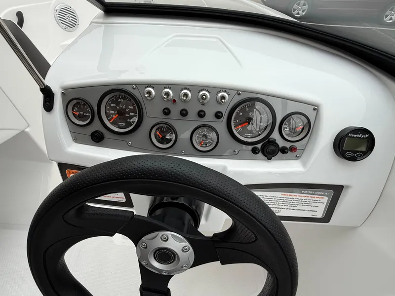 Slide: The Image of Dashboard of 2023 Tahoe 185 S boat with steering wheel and gauges. - 8