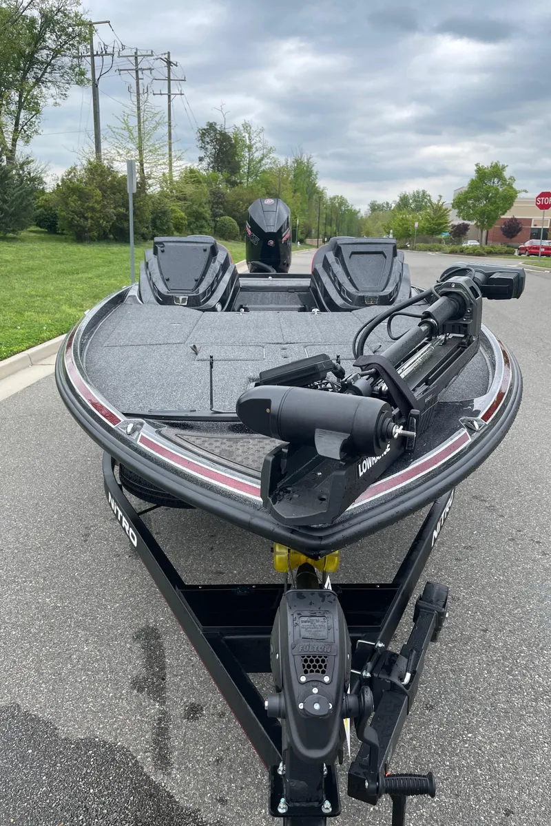 Slide: The Image of 2024 Nitro Z21 XL Pro bass boat on trailer. - 2