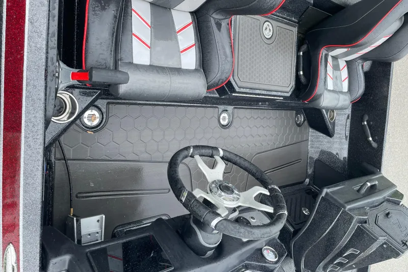 Slide: The Image of 2024 Nitro Z21 XL Pro boat interior with steering wheel and seating. - 3