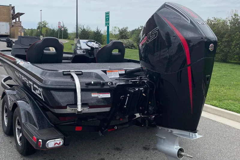 Slide: The Image of 2024 Nitro Z21 XL Pro boat with powerful outboard motor. - 5