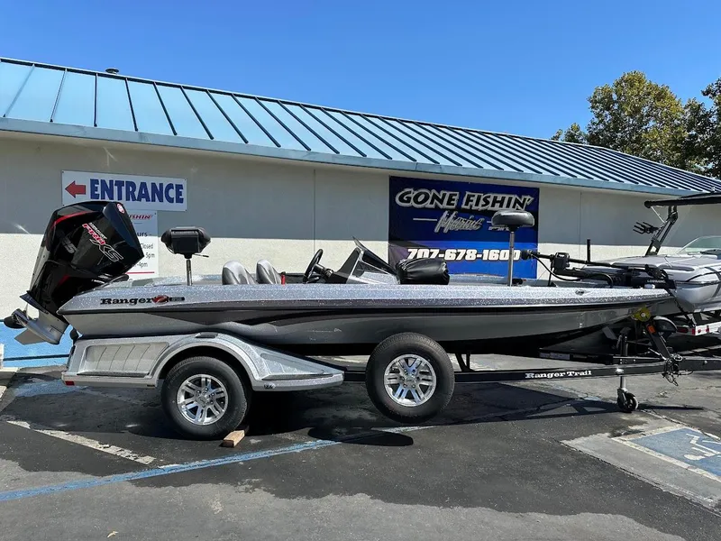 The Image of 2024 Ranger Z519 boat on trailer outside fishing store. - 0