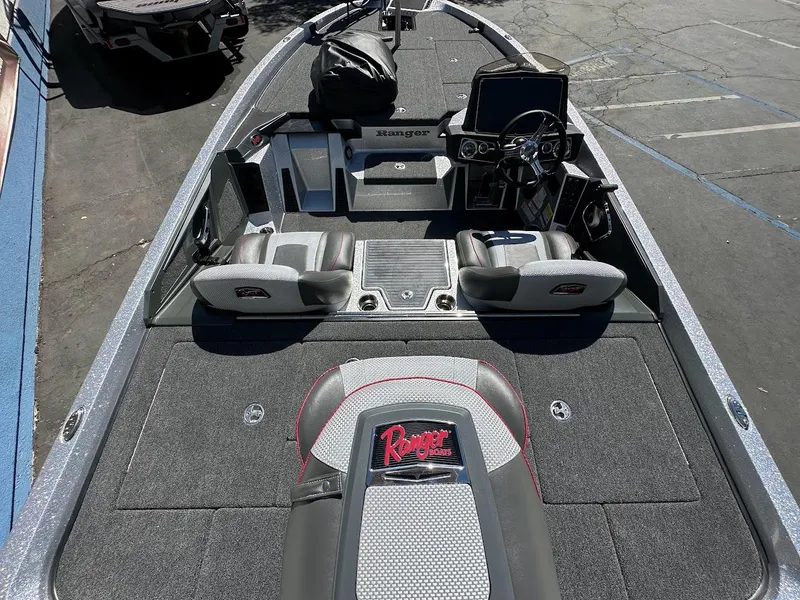 Slide: The Image of 2024 Ranger Z519 boat interior with advanced dashboard and seating. - 11