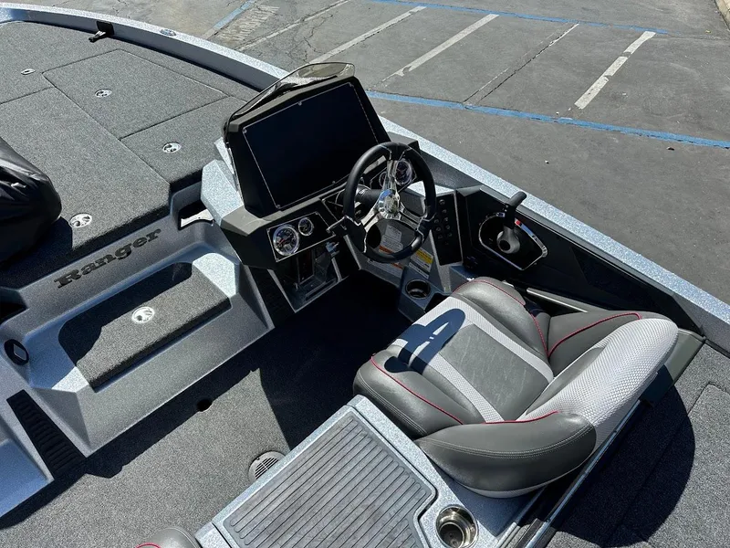 Slide: The Image of 2024 Ranger Z519 boat cockpit with modern steering and seating. - 15