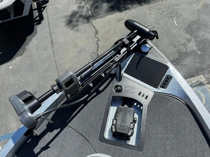 Slide: The Image of 2024 Ranger Z519 boat deck with trolling motor and control panel. - 19