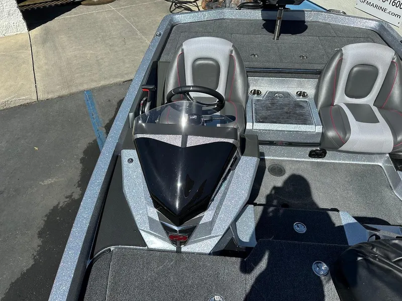 Slide: The Image of 2024 Ranger Z519 boat interior with dual seats and steering console. - 21