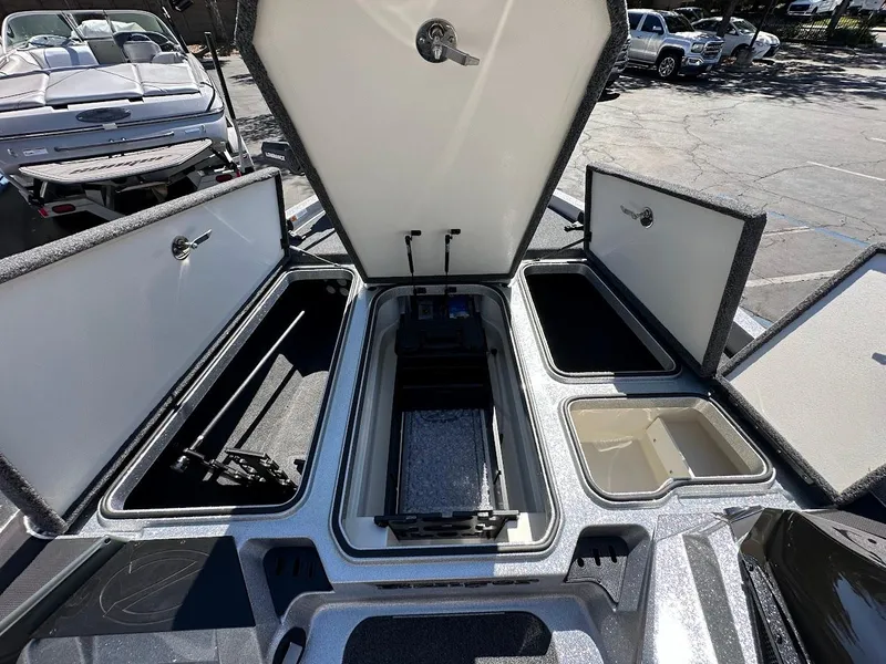 Slide: The Image of 2024 Ranger Z519 boat storage compartments open, showcasing spacious interior design. - 22