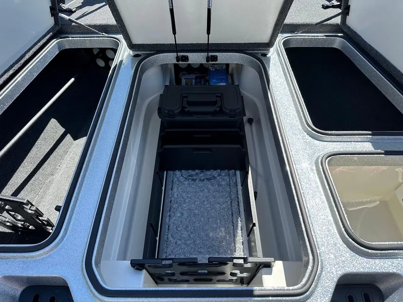 Slide: The Image of 2024 Ranger Z519 boat storage compartments with organized interior layout. - 23