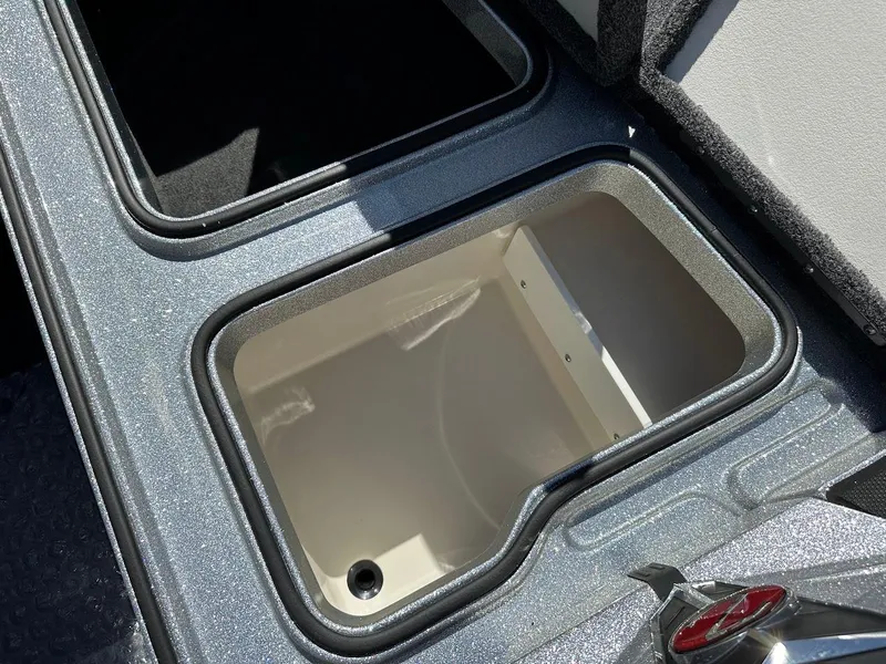 Slide: The Image of 2024 Ranger Z519 boat storage compartment, open and empty, with a sleek design. - 25