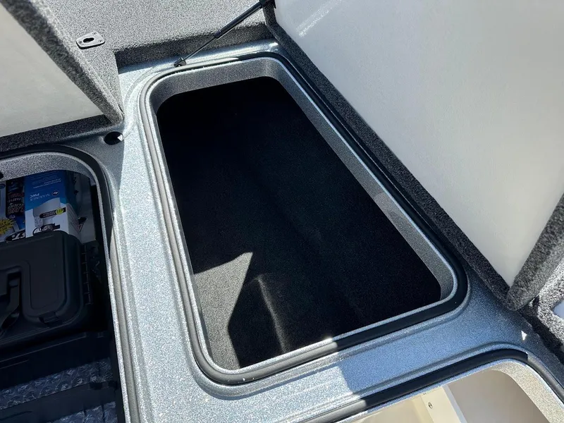 Slide: The Image of 2024 Ranger Z519 storage compartment with open lid, showcasing spacious interior. - 26