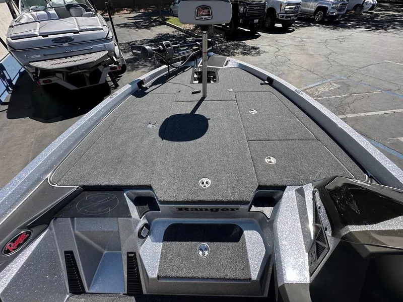 Slide: The Image of 2024 Ranger Z519 boat deck with storage compartments and sleek design. - 28