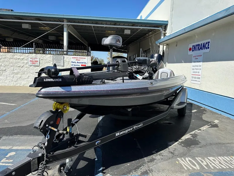 Slide: The Image of 2024 Ranger Z519 boat on trailer in parking lot, featuring Lowrance equipment. - 3