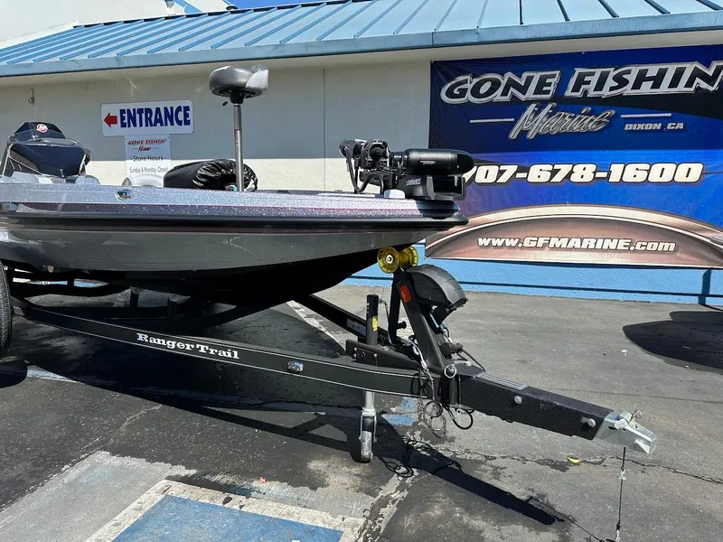 Slide: The Image of 2024 Ranger Z519 boat on trailer at dealership, "Gone Fishing Marine" sign in background. - 4