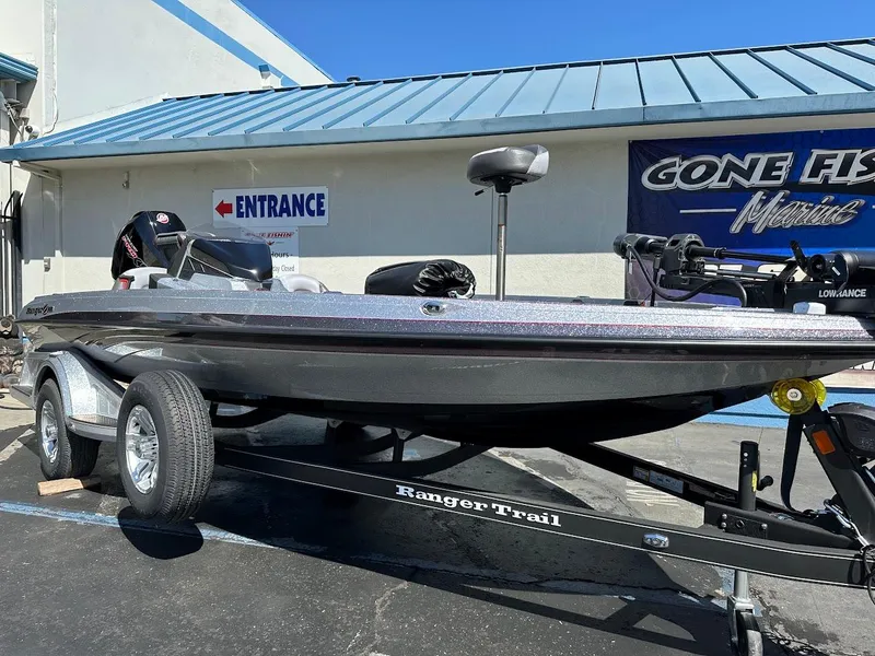 Slide: The Image of 2024 Ranger Z519 boat on trailer outside a marine shop. - 5
