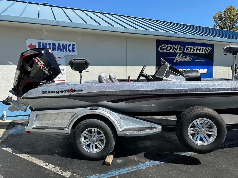 Slide: The Image of 2024 Ranger Z519 boat on trailer outside dealership. - 6