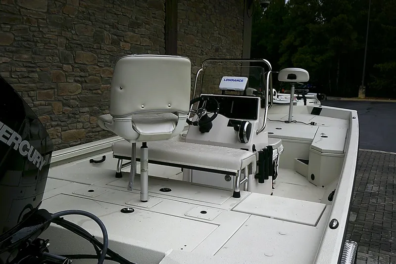 Slide: The Image of 2024 Ranger RB210 boat with Mercury engine, featuring a white interior and advanced navigation equipment. - 6