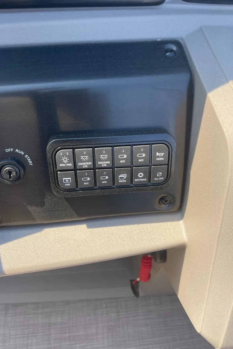 Slide: The Image of Control panel of 2024 Sun Tracker Party Barge 24 DLX pontoon boat. - 2