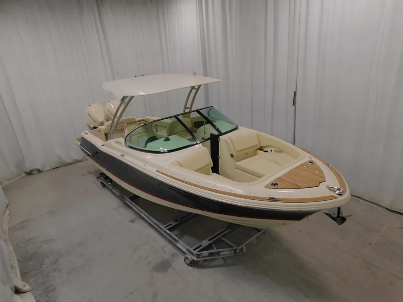 Slide: The Image of 2024 Chris-Craft Calypso 28 boat in showroom, front view. - 1