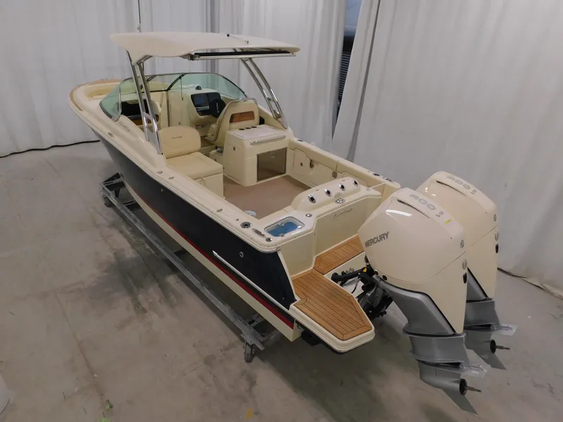 Slide: The Image of 2024 Chris-Craft Calypso 28 boat with dual Mercury outboard engines. - 10