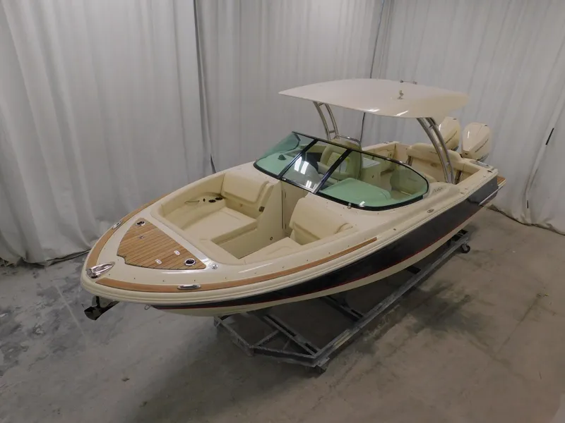 Slide: The Image of 2024 Chris-Craft Calypso 28 boat in showroom, side view. - 4