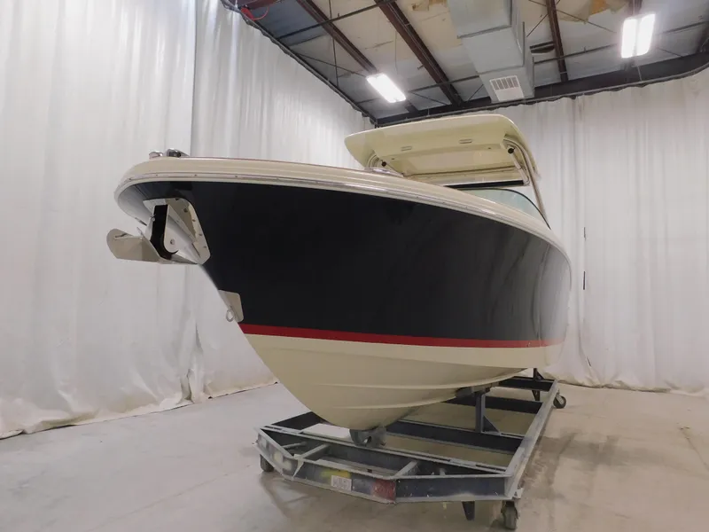 Slide: The Image of 2024 Chris-Craft Calypso 28 boat in indoor storage facility. - 6
