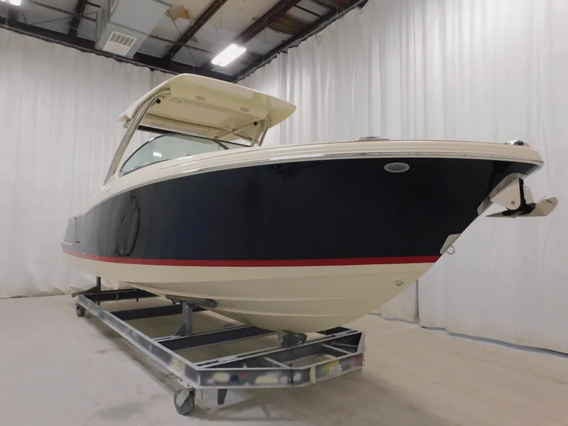 Slide: The Image of 2024 Chris-Craft Calypso 28 boat in indoor storage facility. - 8