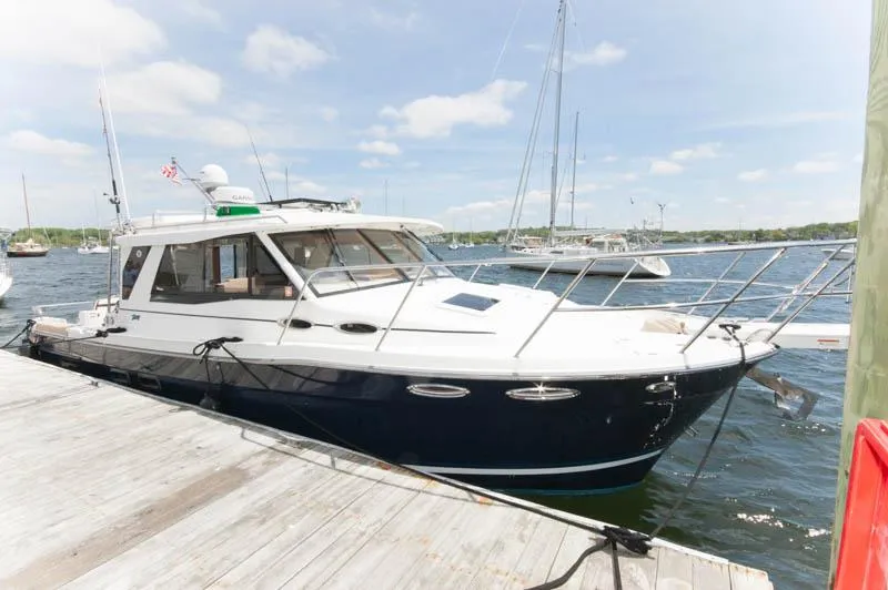 Slide: The Image of 2016 Cutwater 30 Sedan docked at a marina on a sunny day. - 1