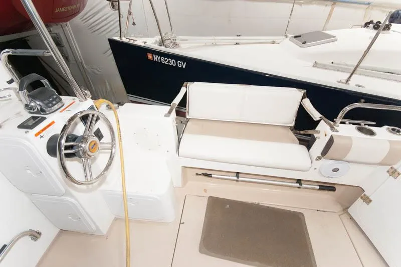 Slide: The Image of 2016 Cutwater 30 Sedan cockpit with steering wheel and seating area. - 11