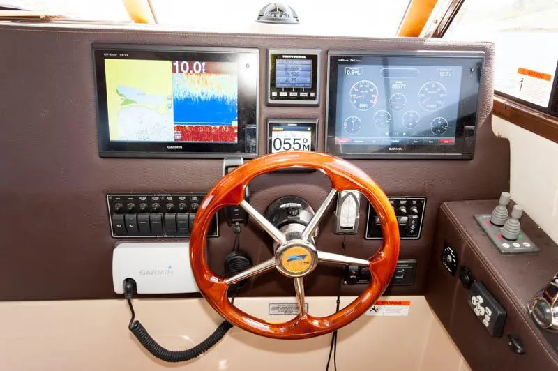 Slide: The Image of 2016 Cutwater 30 Sedan helm with Garmin navigation and control systems. - 12