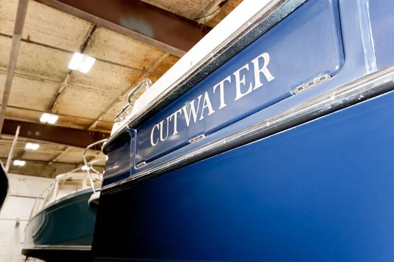 Slide: The Image of 2016 Cutwater 30 Sedan boat in indoor storage. - 20
