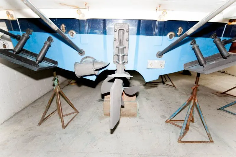 Slide: The Image of 2016 Cutwater 30 Sedan boat propeller and rudder system in dry dock. - 21