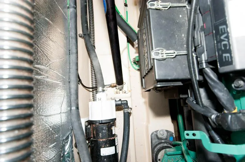 Slide: The Image of Engine compartment of a 2016 Cutwater 30 Sedan boat showing various components and wiring. - 23