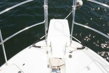 Slide: The Image of Bow of 2016 Cutwater 30 Sedan boat on water. - 6