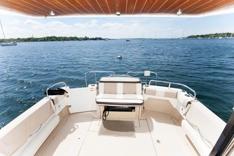 Slide: The Image of 2016 Cutwater 30 Sedan boat with spacious deck and scenic water view. - 7