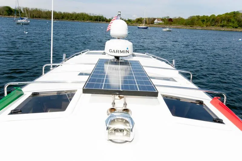 Slide: The Image of 2016 Cutwater 30 Sedan boat with Garmin radar and solar panel on deck. - 9