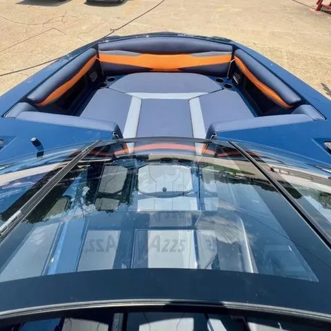 Slide: The Image of 2024 Axis Wake Research A225 boat with blue and orange interior. - 8