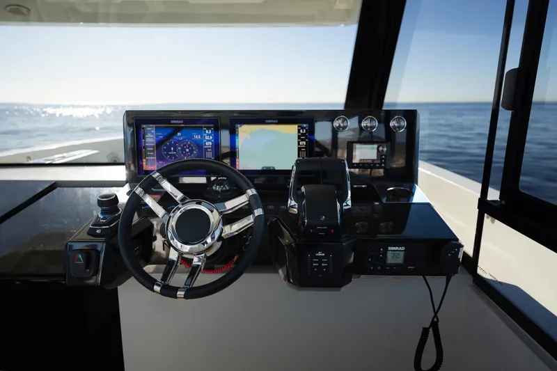 Slide: The Image of 2024 De Antonio Yachts D50 Coupé helm with advanced navigation displays and controls. - 22