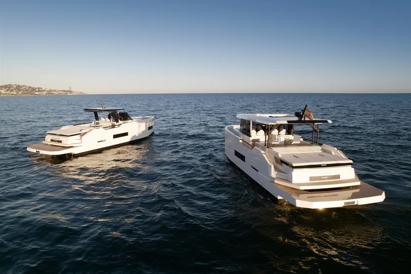 Slide: The Image of 2024 De Antonio Yachts D50 Coupé boats cruising on open water. - 8