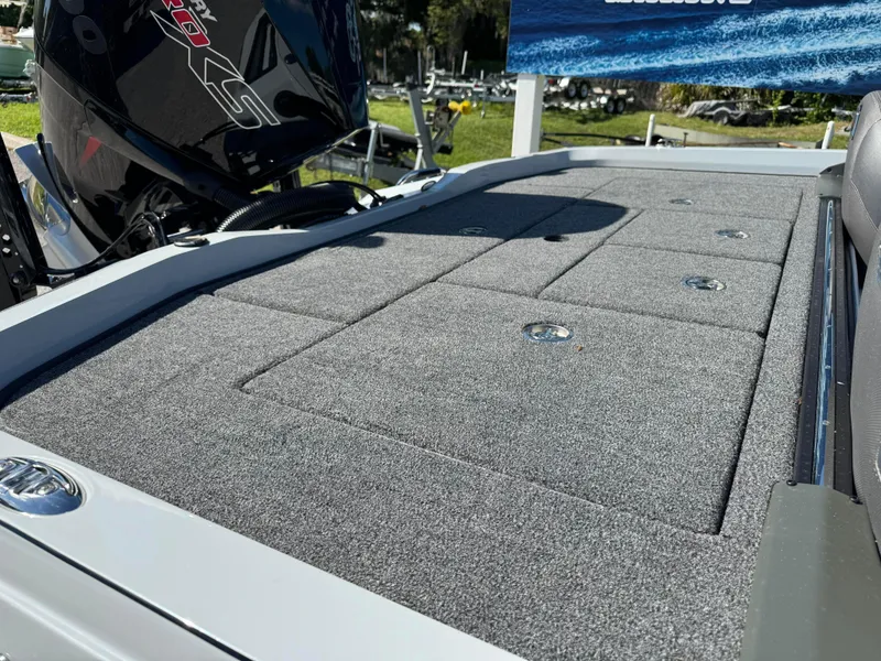 Slide: The Image of 2024 Ranger 518 Cup boat deck with storage compartments and motor. - 3