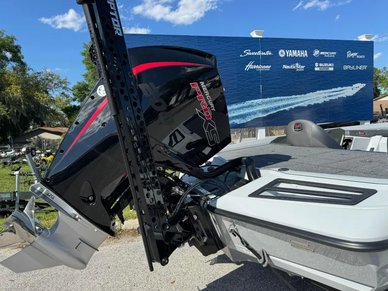 Slide: The Image of 2024 Ranger 518 Cup boat with powerful outboard motor, displayed outdoors under a clear sky. - 7