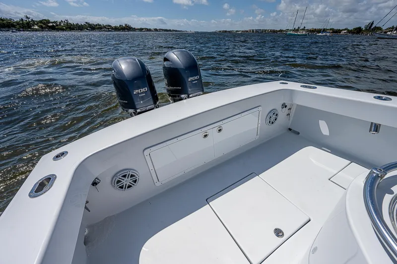 Slide: The Image of 1969 Bertram 25 Moppie boat with twin 200 HP engines on open water. - 10