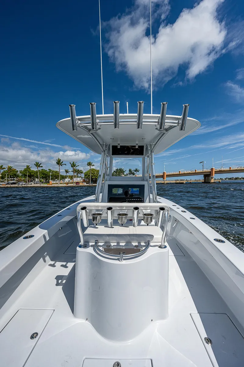 Slide: The Image of 1969 Bertram 25 Moppie boat on water with clear blue sky. - 13