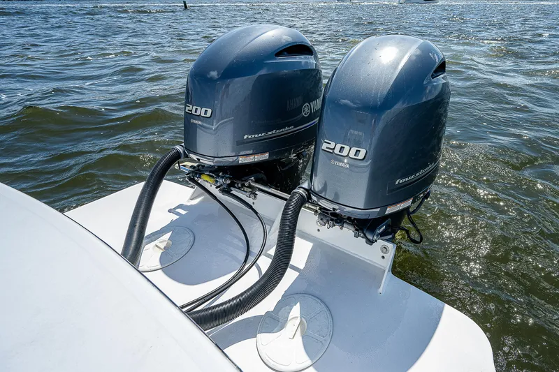 Slide: The Image of Twin Yamaha 200 outboard engines on a 1969 Bertram 25 Moppie boat. - 15