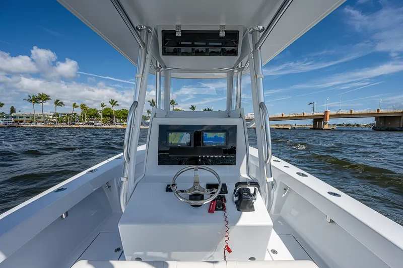 Slide: The Image of 1969 Bertram 25 Moppie boat console with navigation equipment on a sunny day. - 18