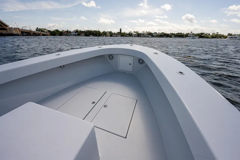 Slide: The Image of 1969 Bertram 25 Moppie boat bow on calm water with clear sky. - 2