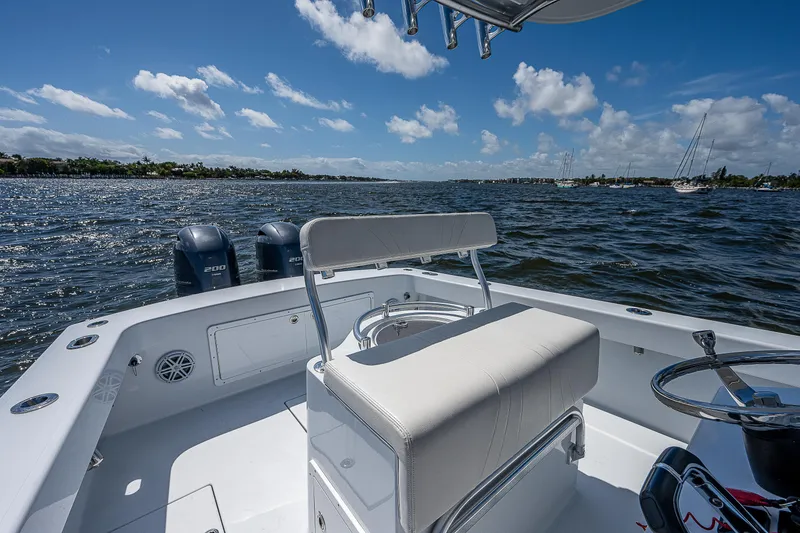 Slide: The Image of 1969 Bertram 25 Moppie boat on a sunny day, view of the helm and seating. - 21
