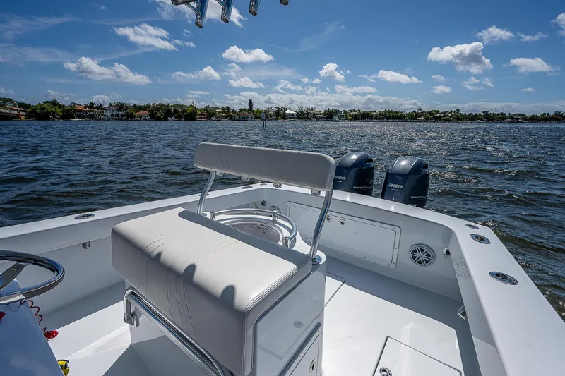 Slide: The Image of 1969 Bertram 25 Moppie boat with twin engines on a sunny day. - 22
